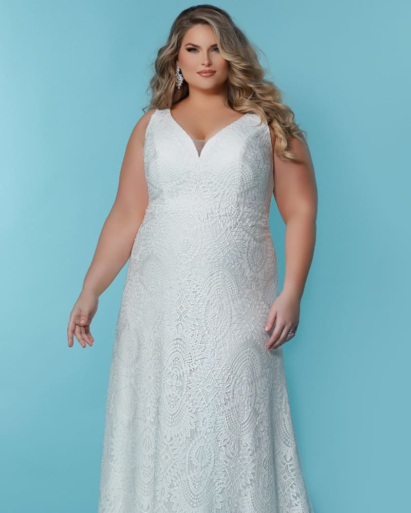 Front of a model wearing a size 24 Ava Grace Wedding Dress in Ivory by Sydney's Closet. | dia_product_style_image_id:285785